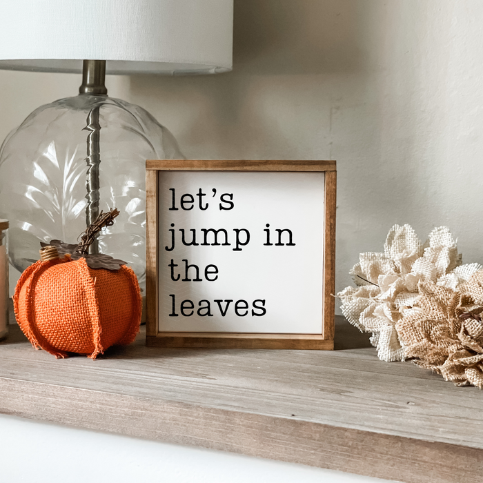 Let's jump in the leaves sign. Fall home decor.