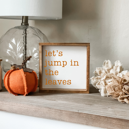 Let's jump in the leaves sign. Fall home decor.
